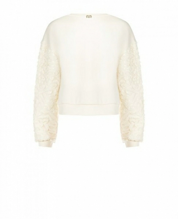 Sudadera con inserciones de tul ondulado y lentejuelas en las mangas.